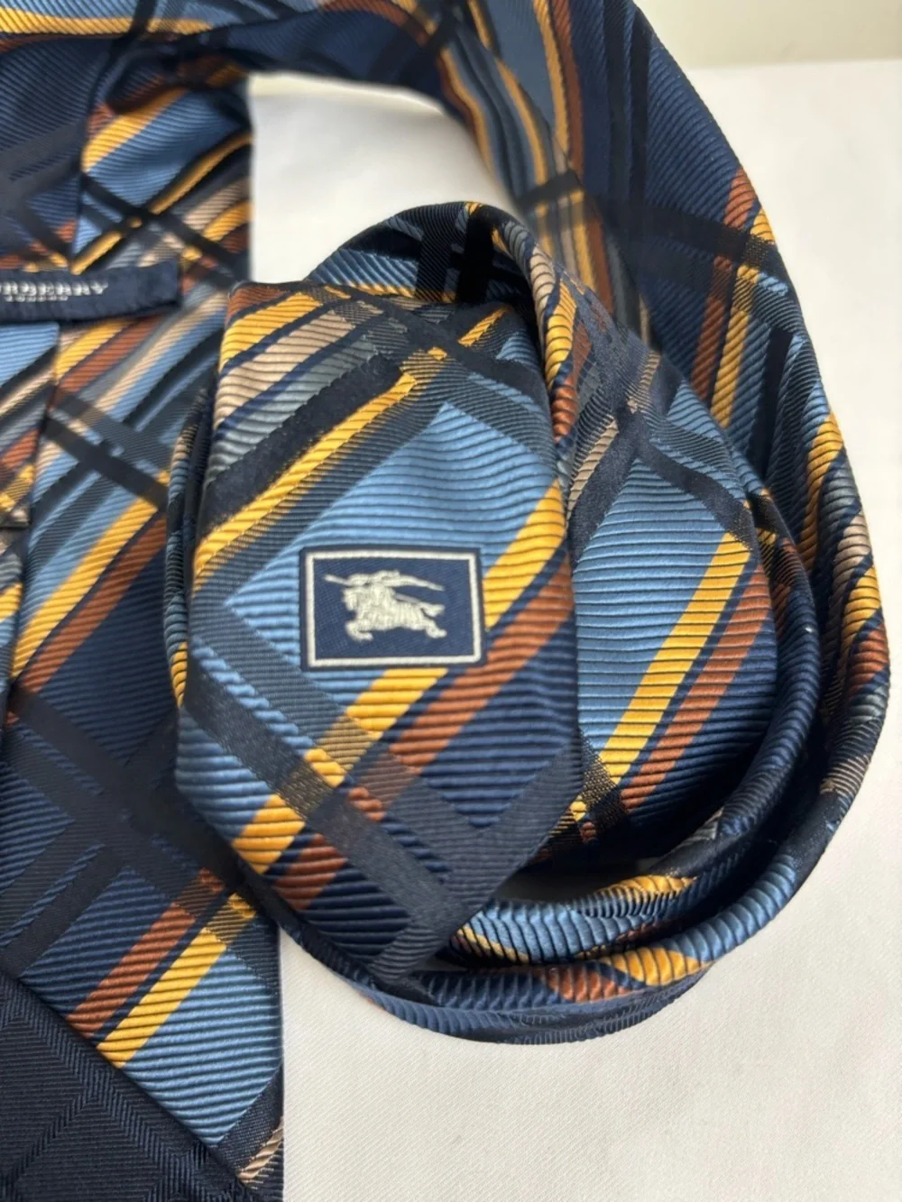 Burberry Silk Tie in Geometric Gold and Navy Blue Pattern